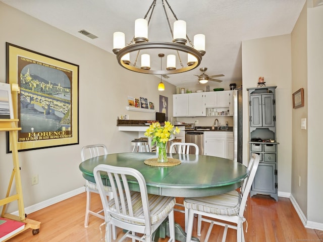 100 Wolfpit Ave Apt 19, Norwalk, CT 06851 - dining space featuring ceiling fan, light wood-style flooring, baseboards, a chandelier, and vaulted ceiling