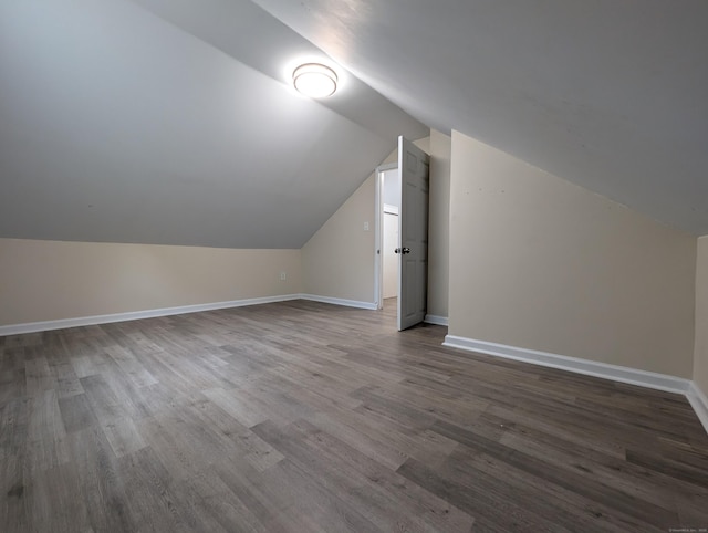26 Westfield St, Manchester, CT 06042 - bonus room with vaulted ceiling, dark wood-style flooring, and baseboards