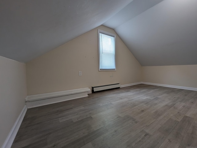 26 Westfield St, Manchester, CT 06042 - additional living space with a baseboard radiator, lofted ceiling, wood finished floors, and baseboards