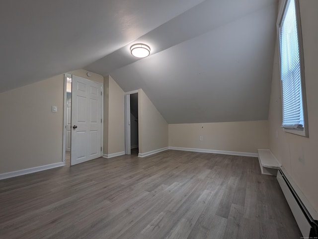26 Westfield St, Manchester, CT 06042 - bonus room with a baseboard heating unit, wood finished floors, lofted ceiling, and baseboards