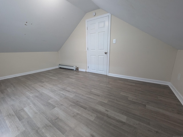 26 Westfield St, Manchester, CT 06042 - additional living space with a baseboard radiator, wood finished floors, lofted ceiling, and baseboards