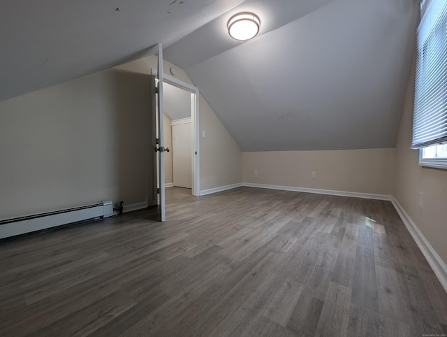 26 Westfield St, Manchester, CT 06042 - bonus room featuring vaulted ceiling, wood finished floors, baseboard heating, and baseboards