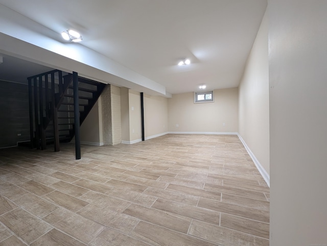 26 Westfield St, Manchester, CT 06042 - below grade area featuring stairway, baseboards, and light wood-type flooring