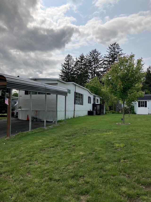 80 Sheldon Rd Lot 12, Griswold, CT 06351 - view of green lawn with a carport