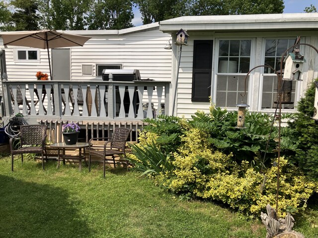 80 Sheldon Rd Lot 12, Griswold, CT 06351 - rear view of house featuring a lawn and a wooden deck