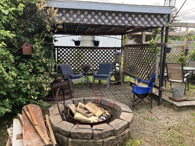 80 Sheldon Rd Lot 12, Griswold, CT 06351 - view of patio featuring a fire pit