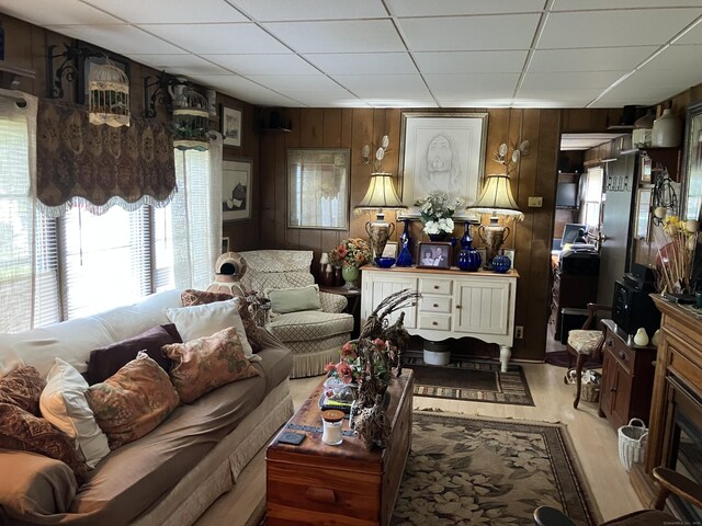 80 Sheldon Rd Lot 12, Griswold, CT 06351 - living room featuring a drop ceiling, wood finished floors, and wooden walls
