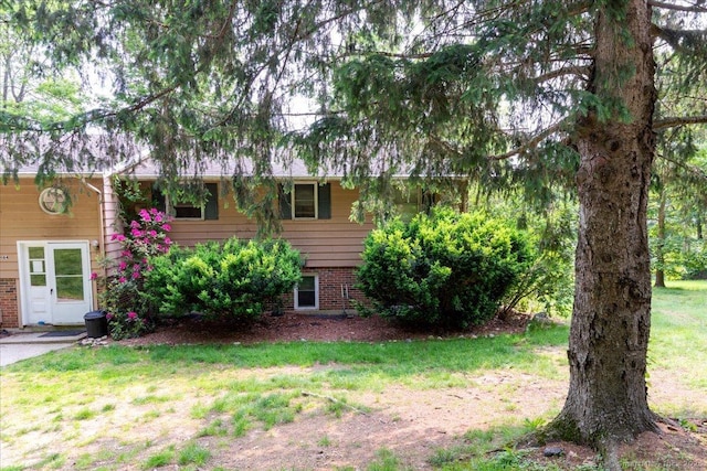 270 S Windham Rd Apt 61, Windham, CT 06226 - view of front facade featuring brick siding and a front yard