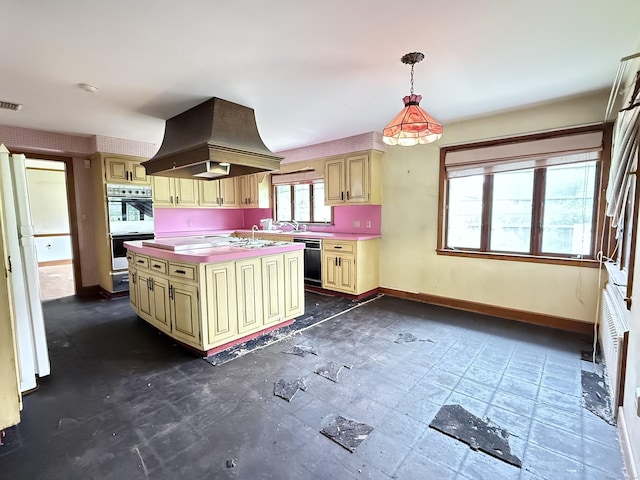 909 Randolph Rd, Middletown, CT 06457 - kitchen with cream cabinetry, island exhaust hood, dishwasher, and baseboards