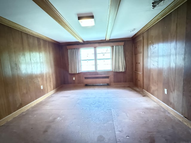 909 Randolph Rd, Middletown, CT 06457 - empty room with radiator heating unit, wood walls, unfinished concrete floors, baseboards, and beam ceiling