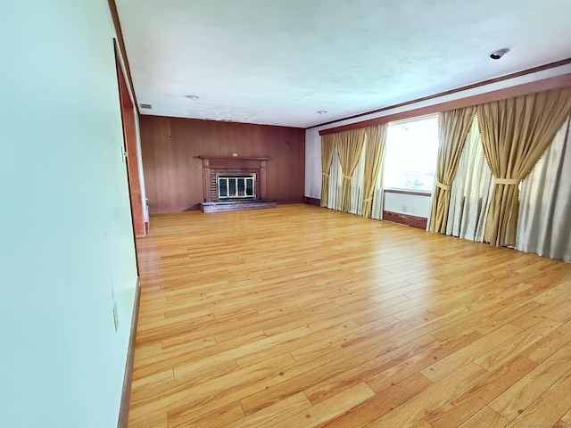 909 Randolph Rd, Middletown, CT 06457 - unfurnished living room featuring light wood-style floors and a fireplace
