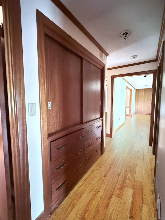 909 Randolph Rd, Middletown, CT 06457 - hallway featuring crown molding, light wood-style flooring, and baseboards