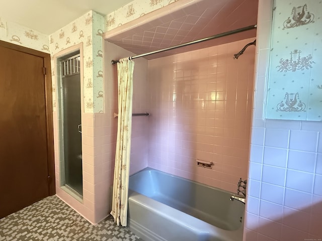 909 Randolph Rd, Middletown, CT 06457 - bathroom featuring wallpapered walls, shower / bathtub combination with curtain, a wainscoted wall, and tile walls