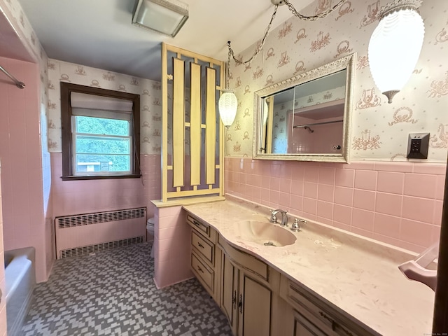 909 Randolph Rd, Middletown, CT 06457 - full bath featuring radiator, tile walls, tile patterned floors, vanity, and a wainscoted wall