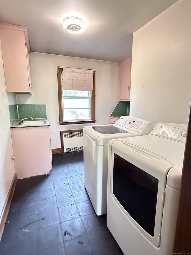 909 Randolph Rd, Middletown, CT 06457 - laundry room with radiator heating unit, washer and dryer, baseboards, and cabinet space