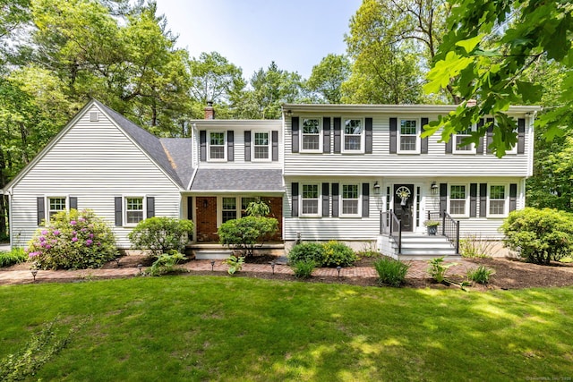 825 Copper Hill Rd, Suffield, CT 06093 - colonial-style house with a chimney, a front lawn, and a shingled roof