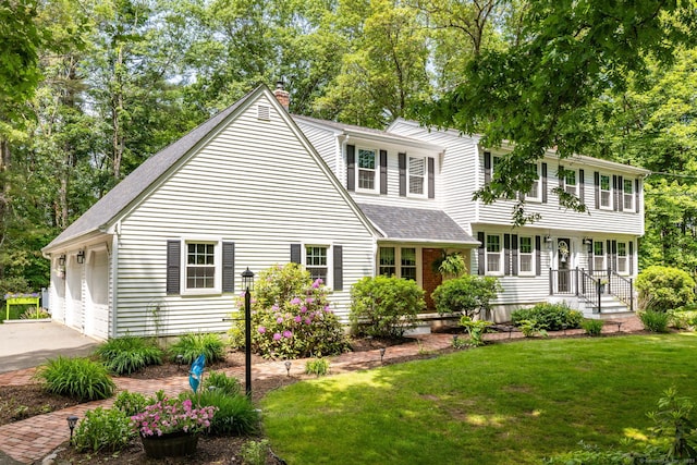 825 Copper Hill Rd, Suffield, CT 06093 - view of front of house featuring a chimney, a shingled roof, asphalt driveway, and a front lawn