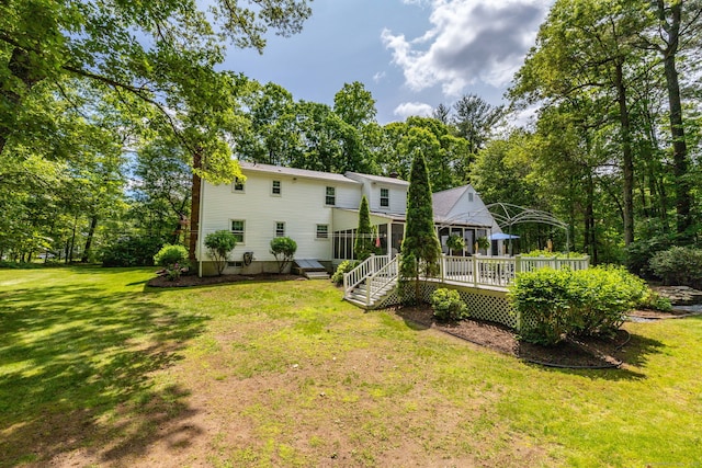 825 Copper Hill Rd, Suffield, CT 06093 - rear view of property featuring a wooden deck and a yard