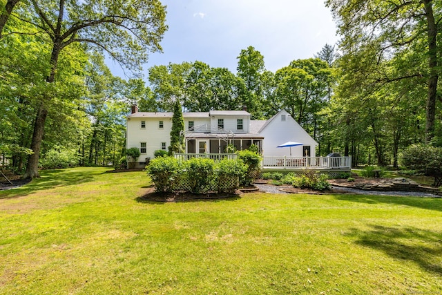 825 Copper Hill Rd, Suffield, CT 06093 - rear view of property featuring a deck, a chimney, and a lawn