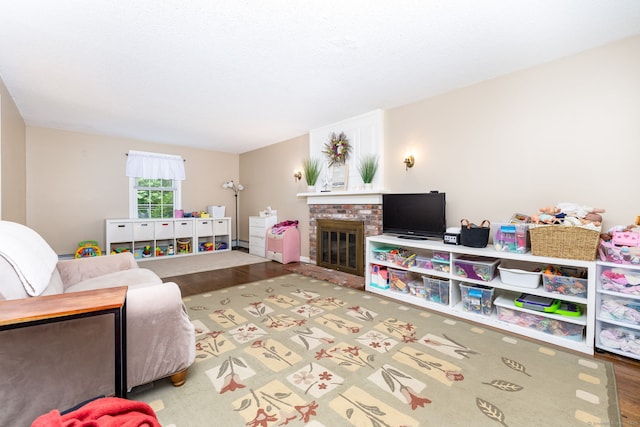 825 Copper Hill Rd, Suffield, CT 06093 - living room with a brick fireplace and wood finished floors
