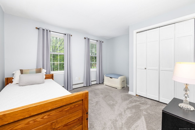 825 Copper Hill Rd, Suffield, CT 06093 - bedroom featuring light carpet, a closet, a baseboard heating unit, and baseboards