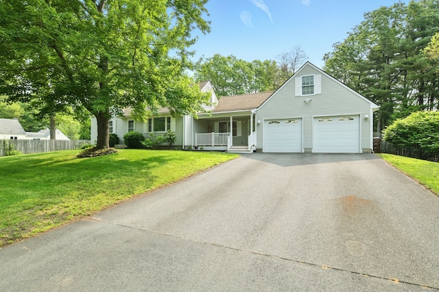 3 Birchwood Ter, Enfield, CT 06082 - view of front of property with asphalt driveway, covered porch, and a garage