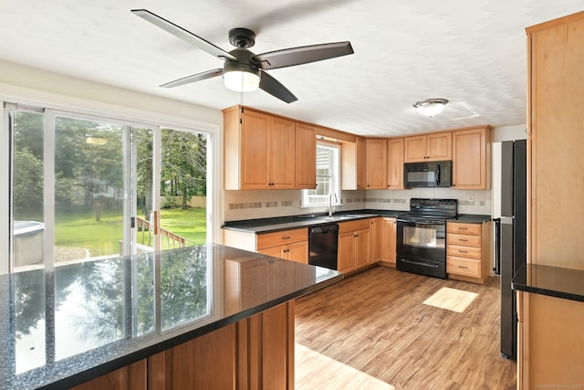 3 Birchwood Ter, Enfield, CT 06082 - kitchen with black appliances, light wood-type flooring, and a ceiling fan