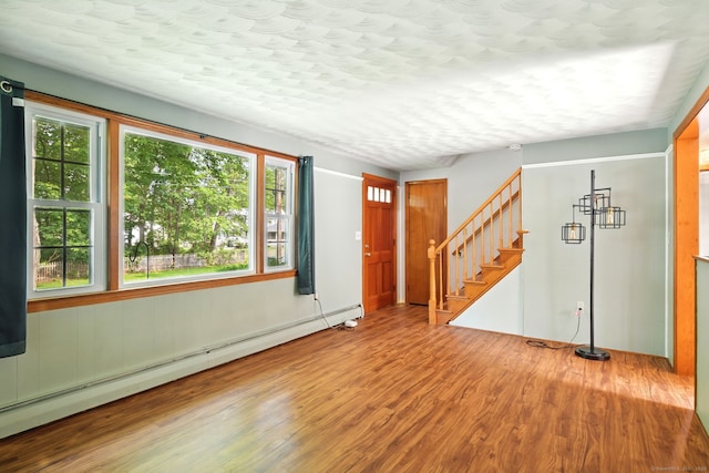 3 Birchwood Ter, Enfield, CT 06082 - spare room with a baseboard radiator, wood finished floors, and stairway