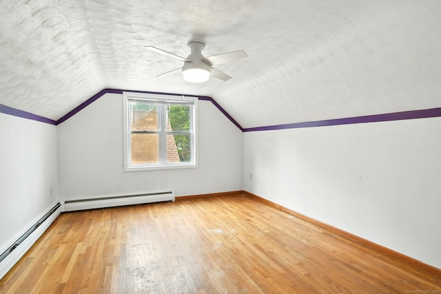 3 Birchwood Ter, Enfield, CT 06082 - additional living space featuring baseboard heating, a ceiling fan, wood-type flooring, vaulted ceiling, and a baseboard heating unit