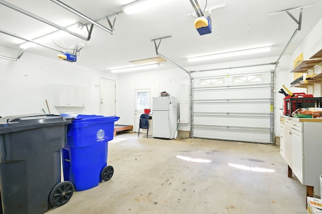 3 Birchwood Ter, Enfield, CT 06082 - garage with freestanding refrigerator and a garage door opener