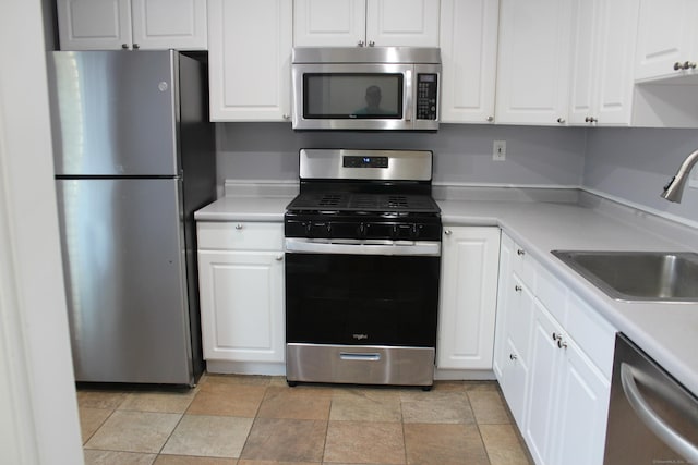 9 Watch Hill Cir Unit 9, Cromwell, CT 06416 - kitchen featuring appliances with stainless steel finishes, a sink, white cabinets, and light countertops