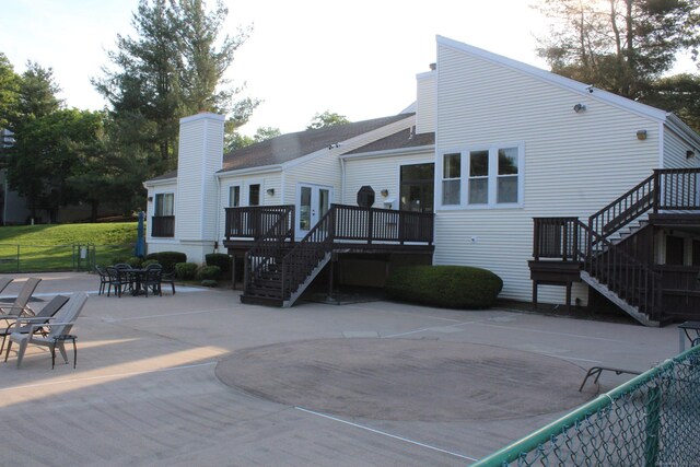 9 Watch Hill Cir Unit 9, Cromwell, CT 06416 - rear view of property with stairway, a wooden deck, a patio, and a chimney