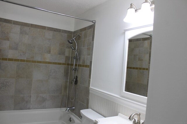 9 Watch Hill Cir Unit 9, Cromwell, CT 06416 - bathroom featuring toilet, bathtub / shower combination, and wainscoting