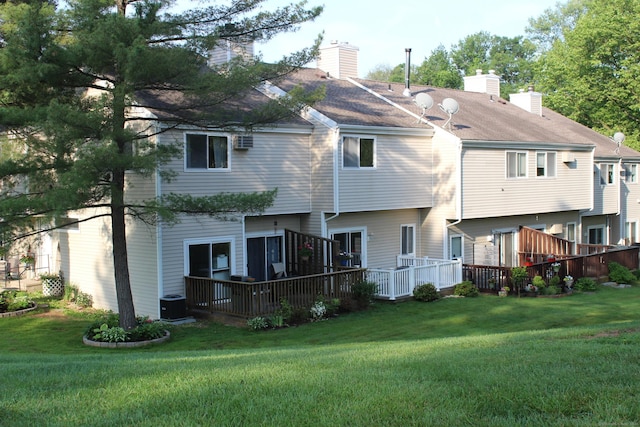 9 Watch Hill Cir Unit 9, Cromwell, CT 06416 - rear view of house featuring a chimney, a lawn, a wooden deck, and central AC unit