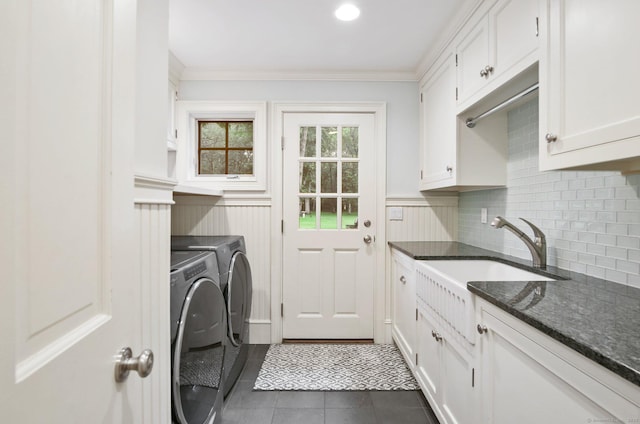 19 Father Peters Ln, New Canaan, CT 06840 - laundry area with washer and dryer, cabinet space, ornamental molding, and dark tile patterned floors