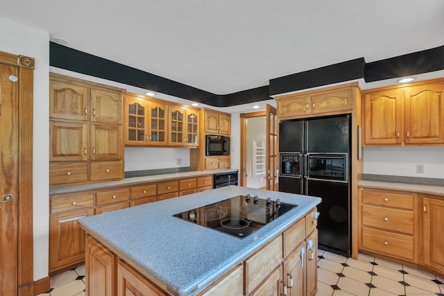 192 Palmer Rd, Chaplin, CT 06235 - kitchen with black appliances, a center island, glass insert cabinets, light floors, and light countertops