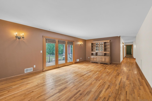 192 Palmer Rd, Chaplin, CT 06235 - unfurnished living room featuring light wood-style flooring