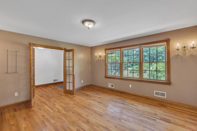 192 Palmer Rd, Chaplin, CT 06235 - unfurnished room with light wood-style floors and french doors