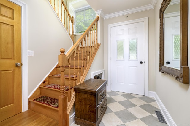 10 Dry Hill Ct, Norwalk, CT 06851 - foyer featuring tile patterned floors, ornamental molding, stairs, and baseboards