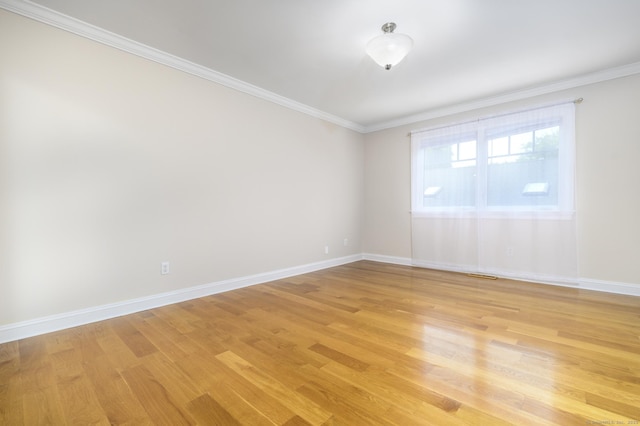 10 Dry Hill Ct, Norwalk, CT 06851 - spare room featuring light wood-style floors, baseboards, and crown molding
