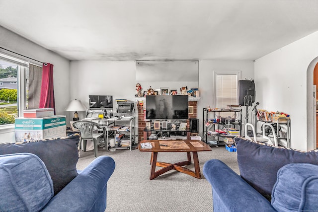 214 Thames St, New London, CT 06320 - carpeted living area featuring arched walkways