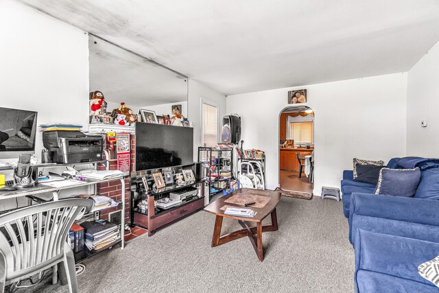 214 Thames St, New London, CT 06320 - living area featuring carpet floors and arched walkways