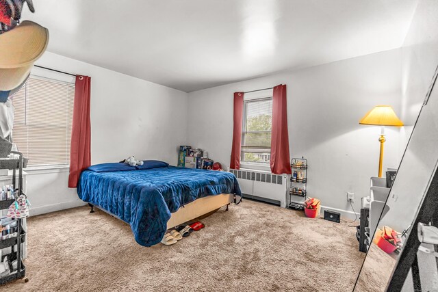 214 Thames St, New London, CT 06320 - carpeted bedroom with radiator heating unit and baseboards