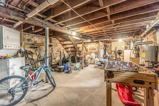 214 Thames St, New London, CT 06320 - unfinished basement featuring estacked washer and dryer and water heater