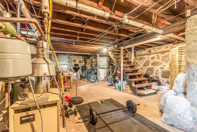 214 Thames St, New London, CT 06320 - unfinished below grade area with stairs and a heating unit