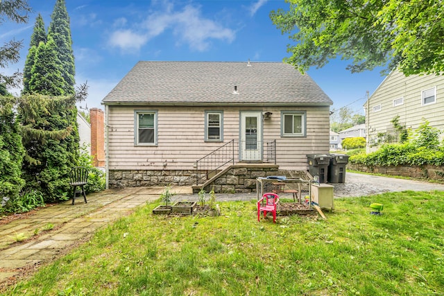 214 Thames St, New London, CT 06320 - rear view of property featuring a yard and roof with shingles