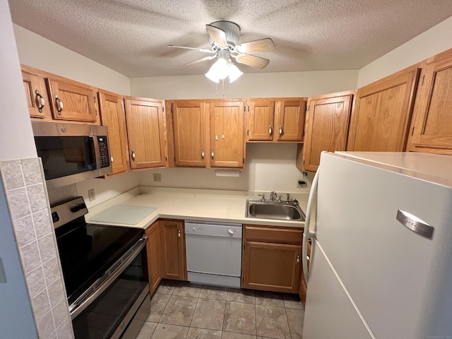 415 E Mitchell Ave Unit 415, Cheshire, CT 06410 - kitchen featuring stainless steel appliances, a sink, a ceiling fan, light countertops, and a textured ceiling