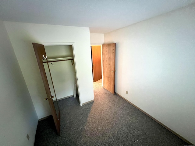 415 E Mitchell Ave Unit 415, Cheshire, CT 06410 - unfurnished bedroom featuring a closet and baseboards