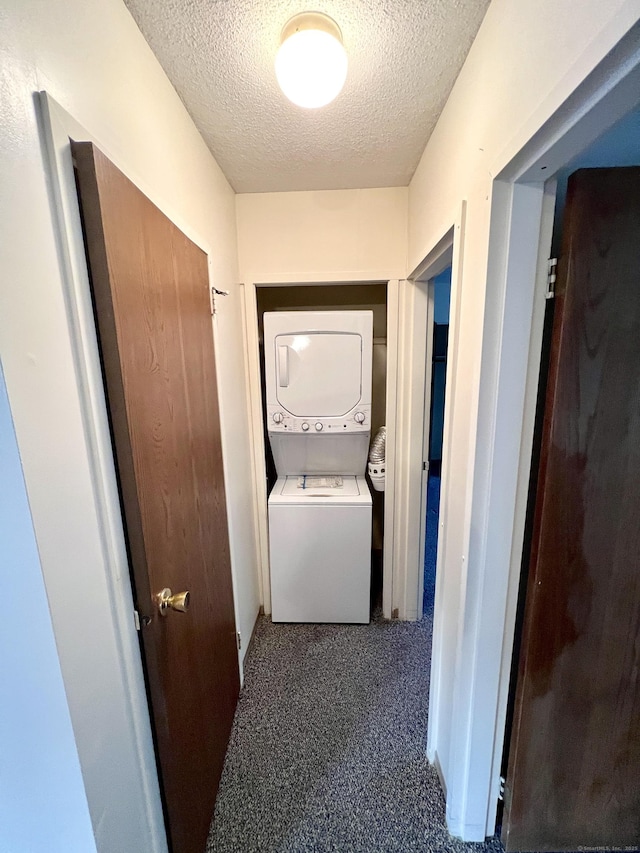 415 E Mitchell Ave Unit 415, Cheshire, CT 06410 - washroom with estacked washer and dryer, a textured ceiling, and carpet