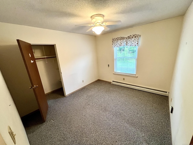 415 E Mitchell Ave Unit 415, Cheshire, CT 06410 - unfurnished bedroom featuring baseboard heating, a textured ceiling, a closet, a ceiling fan, and baseboards